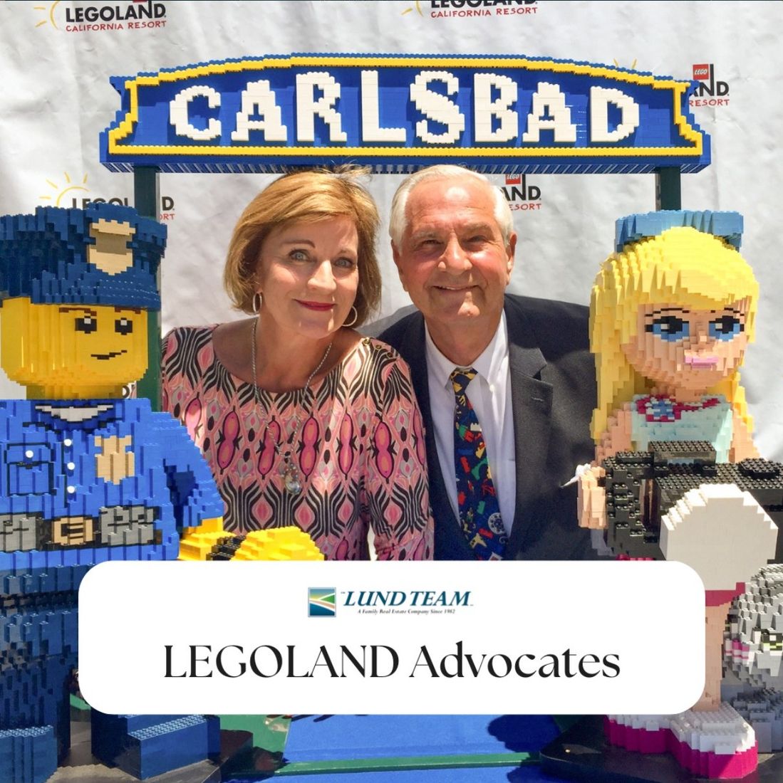Sandy and Carlton Lund at the LEGOLAND CARLSBAD sign